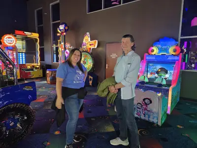 Two people in arcade games
