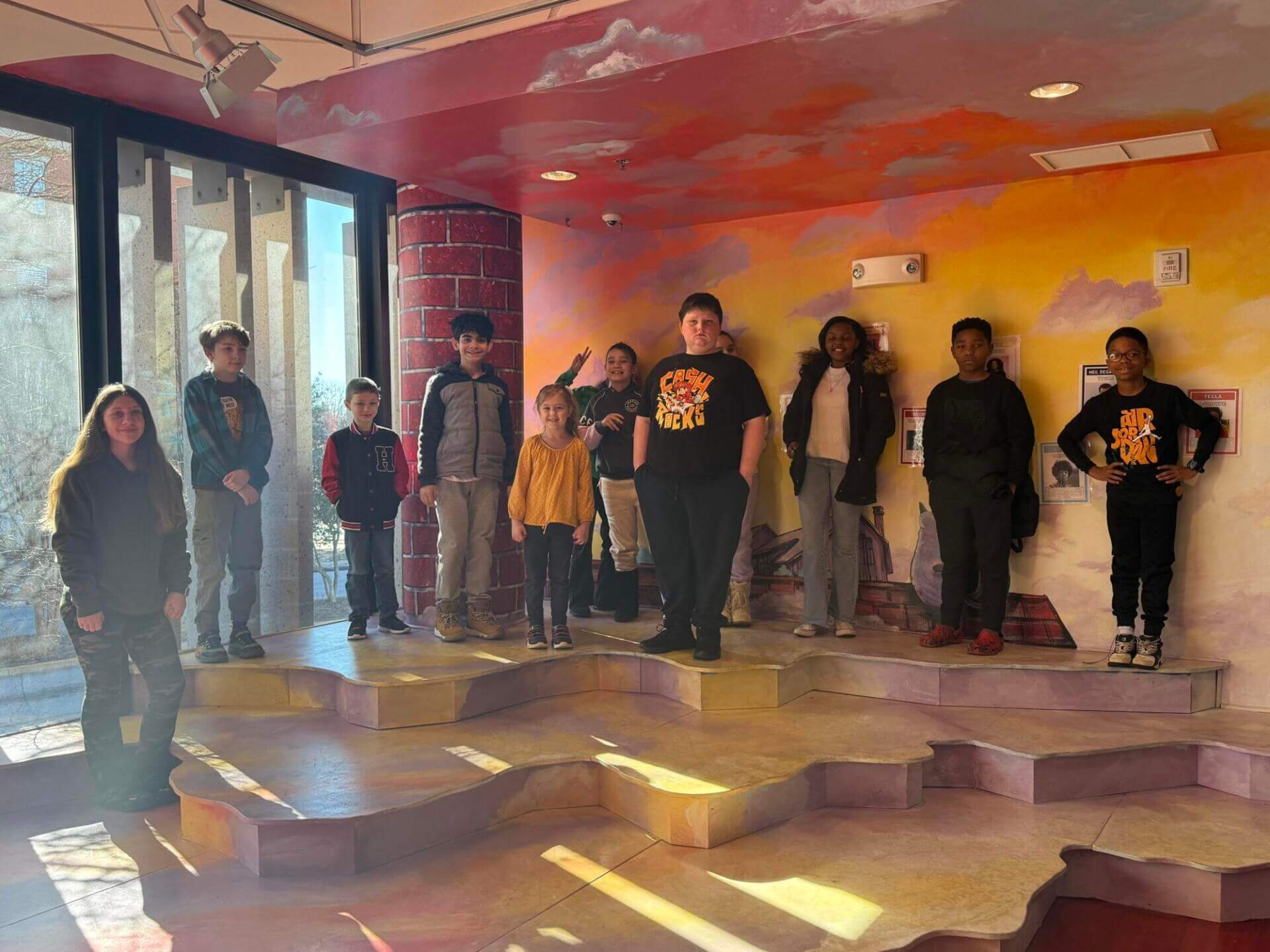 Kids standing in front of a wall