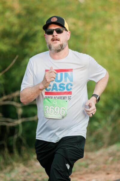 Man running with a CASC shirt