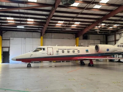 Private jet in a spacious hangar, labeled "Organ & Tissue Transport."